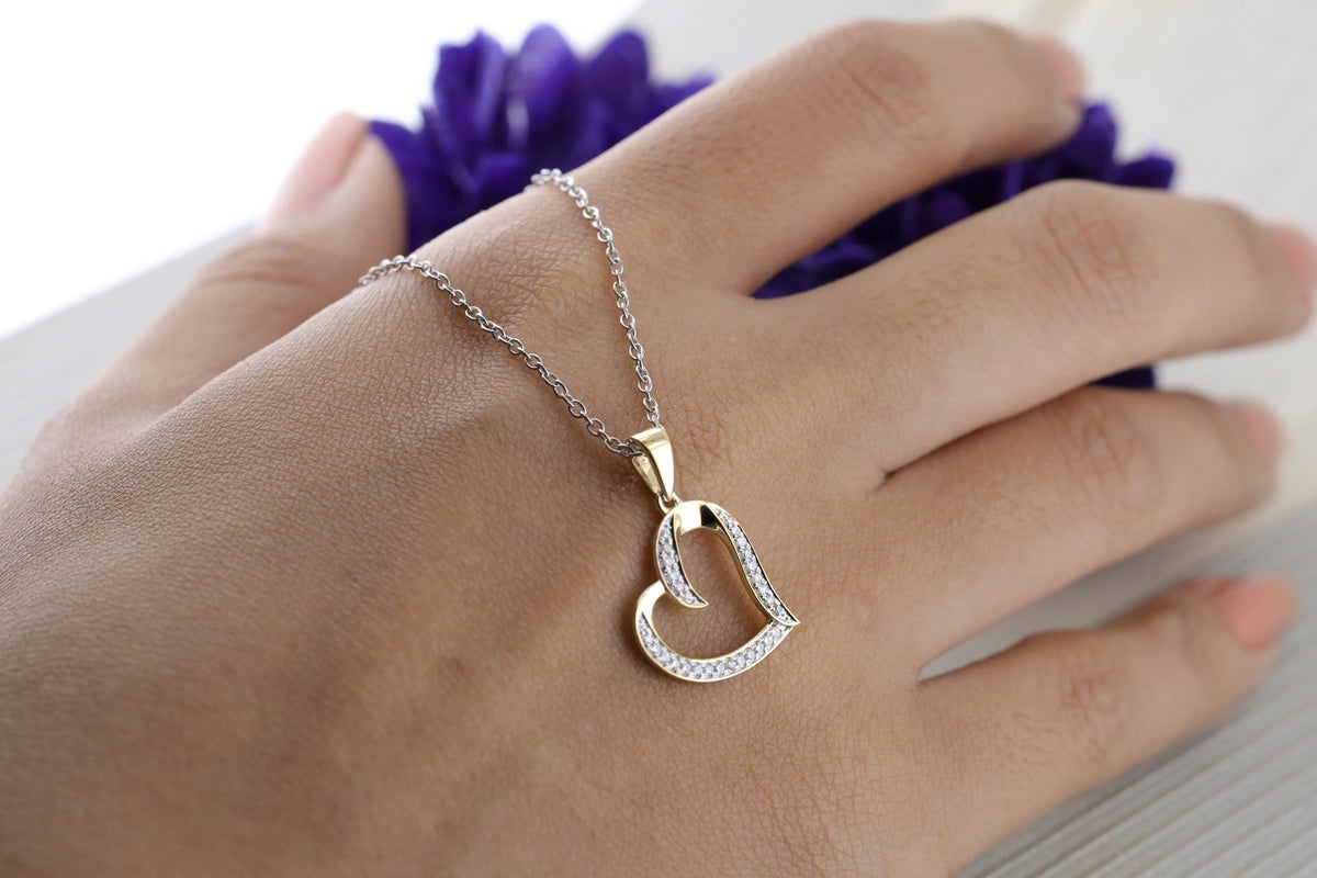 Round White Diamond Heart Pendant with 18 Inch Silver Chain in 10K Yellow Gold D25627